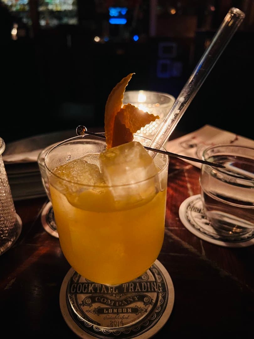 Signature cocktail with garnish at The Cocktail Trading Co., Shoreditch, London
