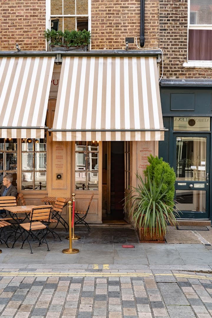 Front entrance with outdoor seating at The Grazing Goat Pub & Boutique Hotel Marylebone, London