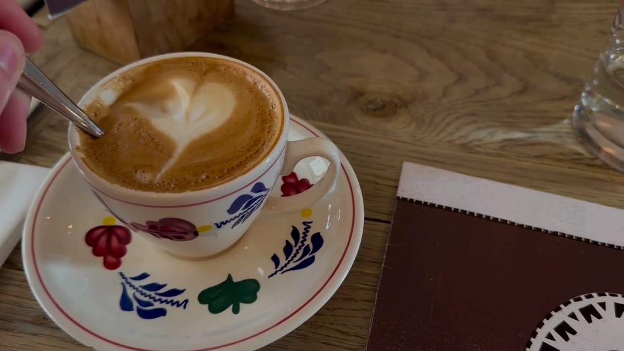 Latte coffee in decorative floral cup at The Grazing Goat Pub & Boutique Hotel Marylebone, London