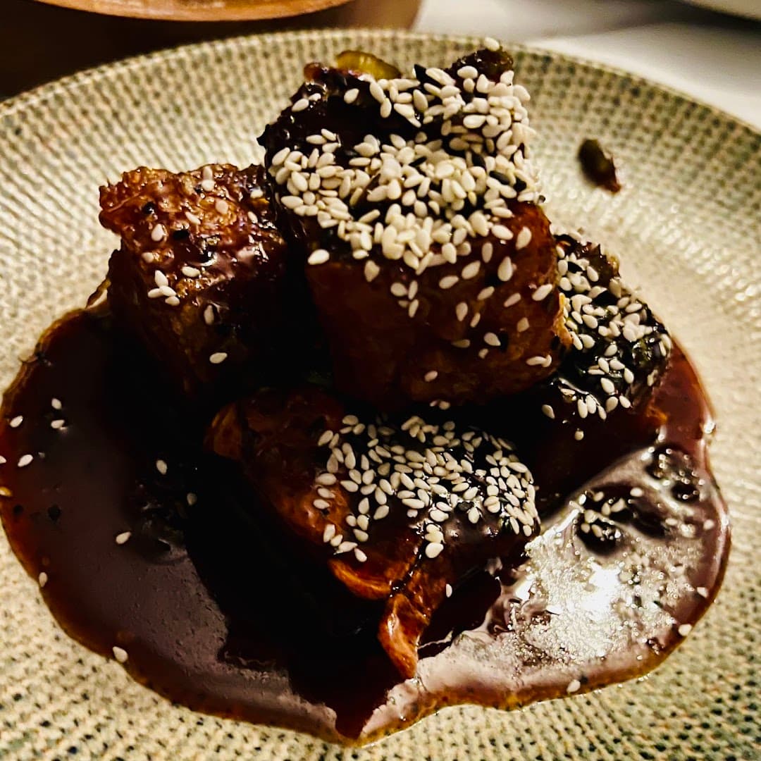 Sesame-glazed meat dish at The Rising Sun, London