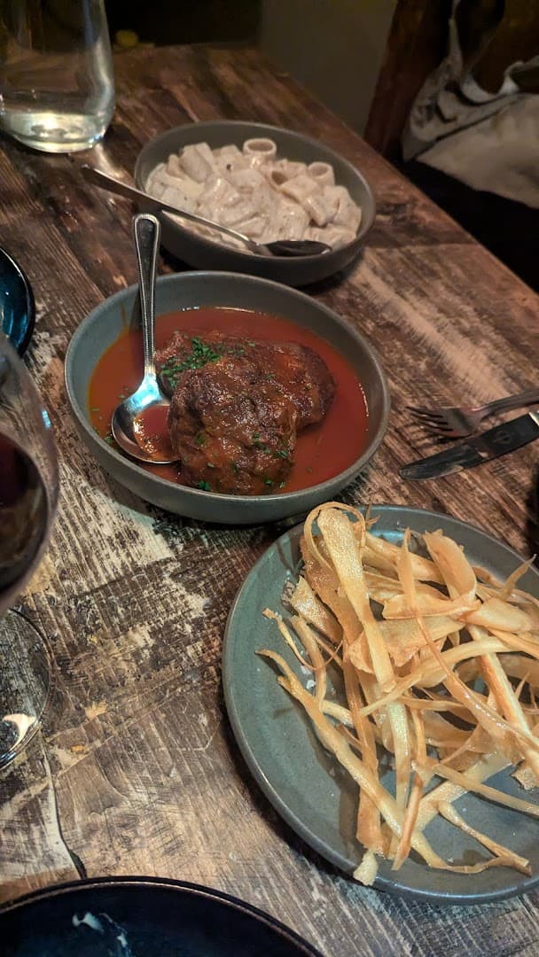 Sharing plates with meatball, fries and pasta at Vins, London
